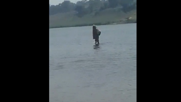  Woman walking on Narmada River 