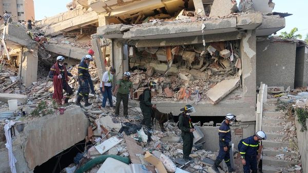 Rescue worker helping survivor from Venezuela earthquake rubble Rescue worker helping survivor from Venezuela earthquake rubble