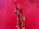 People soak themselves in colours of Holi 