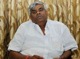 K'taka floods: Minister HD Revanna throws relief material at flood victims