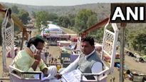 For phone signal, MP Minister climbs atop 50 foot high swing
