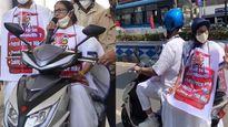 West Bengal CM Mamata Banerjee rides pillion on electric scooter to protest fuel price hike 