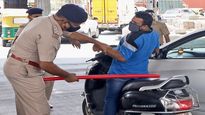 Lockdown-like restrictions in Karnataka kick in; Policemen wielding lathis on violators in Bengaluru