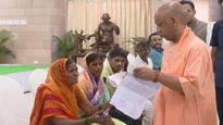 UP CM Yogi Adityanath Orders Urgent Cancer Treatment For Son Of Elderly Woman During Janata Darshan