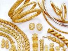Gold hits record high of Rs 14,407 