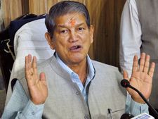 Rawat accepts his 'presence' in sting CD