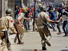 Indian Army in Kashmir fighting people shouting ‘go back Indian dogs’ slogan