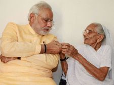 Modi meets mother on b'day, BJP turns visit into poll bugle with 67 events 