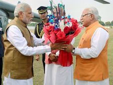 Modi government bans bouquet culture on tours, says can give books, Khadi handkerchief or flower