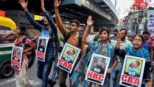 TMC women members in Kolkata sport mehendi with no 'CAA' , 'NRC' slogan 