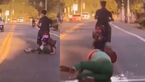 Instant karma! Woman falls while trying to kick bike rider, video goes viral