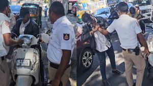 Caught On Cam: Man Bites Cop For Stopping Him For Not Wearing Helmet