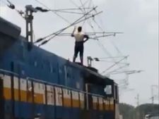 షాకింగ్ : రైలుపైకి ఎక్కి.. హై టెన్షన్ విద్యుత్ తీగలు తాకి.. యువకుడి ఆత్మహత్య