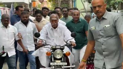 Puducherry Elections: CM N Rangaswamy Rides Bike To Cast Vote, Continues Decades-Old Tradition