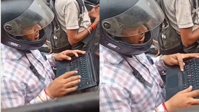 ಟ್ರಾಫಿಕ್ನಲ್ಲಿ ಬೈಕ್ ನಿಲ್ಲಿಸಿ ಲ್ಯಾಪ್ಟಾಪ್ನಲ್ಲಿ ಕೆಲಸ ಮಾಡುತ್ತಿರುವ ಉದ್ಯೋಗಿ; ವೈರಲ್ ಆಯ್ತು ವಿಡಿಯೋ