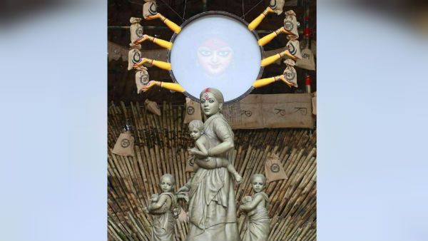 সন্তান কোলে মা ত্রাণের খোঁজ করছেন, পরিযায়ী শ্রমিকদের শ্রদ্ধা জানাতে বিশেষ ভাবনা কলকাতার এই পুজোর