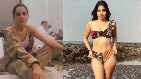 હૉસ્પિટલના બેડ પર કોટના બટન ખુલ્લા કરીને બેઠી