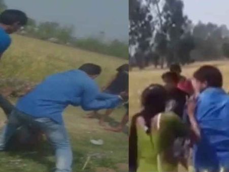 देखें VIDEO: खेत में बैठे प्रेमी-प्रेमिका को गांव वालों ने दौड़ा-दौड़ाकर पीटा