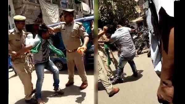 दरोगा-सिपाही ने बीच सड़क पर युवक के बाल खींचकर की धुनाई, वीडियो वायरल के बाद दोनों हुए निलंबित