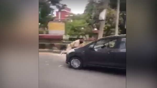 VIRAL VIDEO: युवक को रोकने की कोशिश की तो पुलिसवाले पर चढ़ा दी कार और बोनट पर लटका रहा ASI