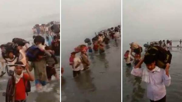 जान जोखिम में डालकर घर लौट रहे प्रवासी मजदूर, सिर पर सामान रख कर रहे यमुना पार, देखें Video