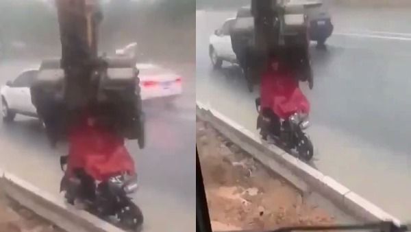 Viral Video: तेज बारिश में भीग रहे बाइक सवार के लिए JCB बनी छतरी, वीडियो देखकर आप भी कहेंगे वाह!
