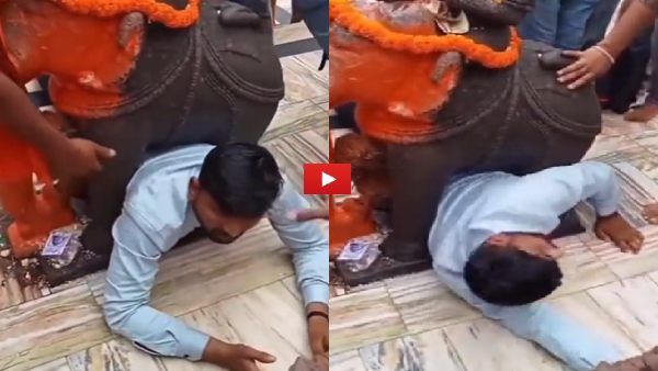 Video: मंदिर में मूर्ति के बीच अटकी 'जान', हालत हुई खराब, मन्नत पूरी होने पर कर रहा था पूजा