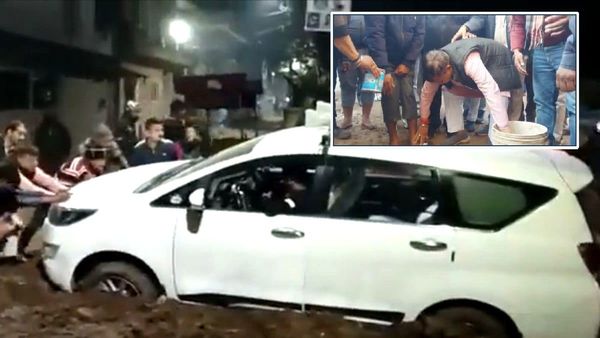 Video : कीचड़ में फंसी कार को धक्का देते नजर आए शिवराज के मंत्री, युवक के पैर धोकर मांगी माफी