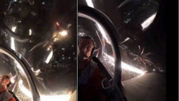 आसमान में खूबसूरत पटाखों के बीच से निकला विमान, पायलट ने दिखाया अद्भुत नजारा, WATCH VIDEO