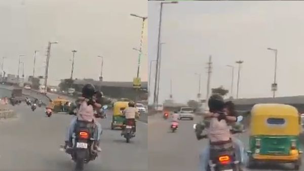 दिल्ली की सड़क पर बाइक चलाते हुए शख्‍स की बाहों में लिपट कर रोमांस करती नजर आई युवती, देखें  Video