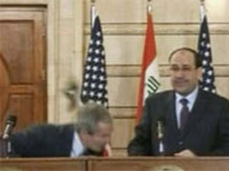 Iraqi Journalist throws shoe at George W Bush