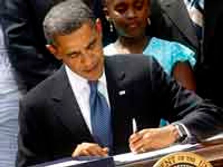 Obama signs Wall Street reform bill into law