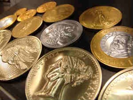 Gold gains Rs 55 on wedding season demand, silver sheds Rs 500