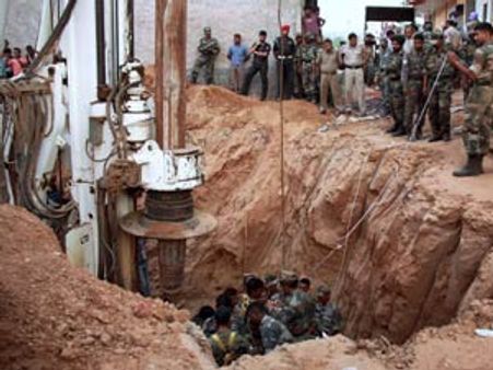 Rescuers manage to reach girl trapped in borewell