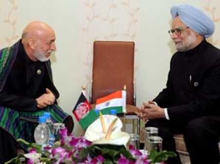 Singh meets Karzai, holds talks with Syrian Prime Minister