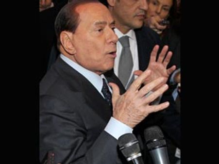 Topless women activists protest in Milan as Berlusconi votes