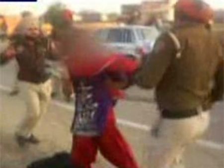 Punjab cops beating harassed woman caught on camera