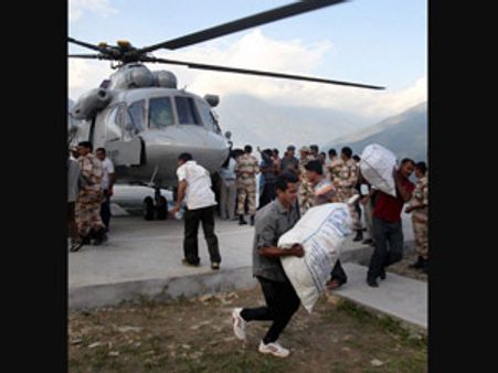 Delhi BJP distributes relief material among flood victims