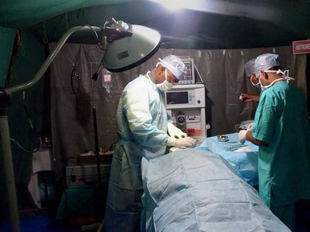 Braving tremors, doctors carry on with C-section to deliver baby