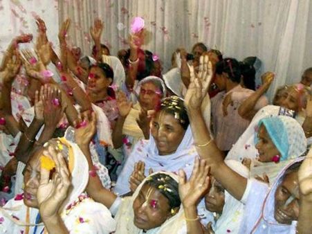 Vrindavan widows celebrate Holi at a temple