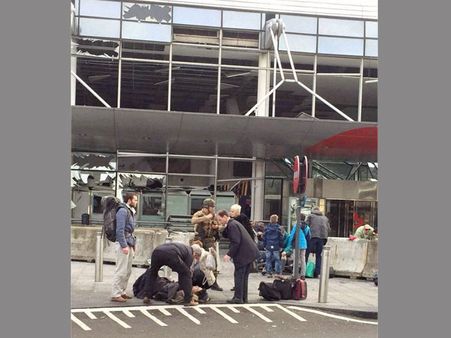 Brussels airport delays reopening; death toll lowered to 32
