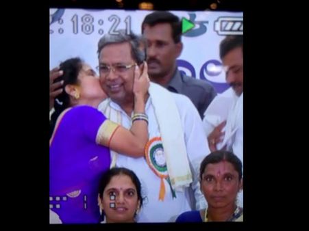Bengaluru: Siddaramaiah kissed by a female fan in public event