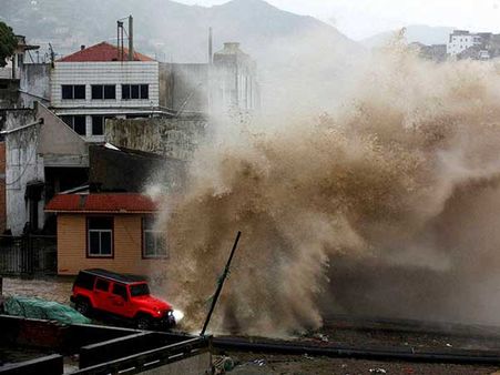 After soaking Hong Kong, weakened Typhoon Nida moves to mainland China