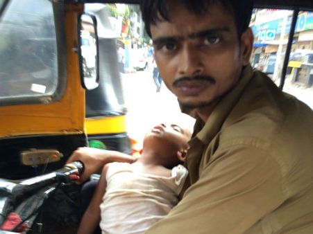 With his wife at home paralysed, this auto driver who carried his son around gets help