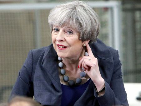 UK's May grilled by voters, urged to confront Trump on Paris