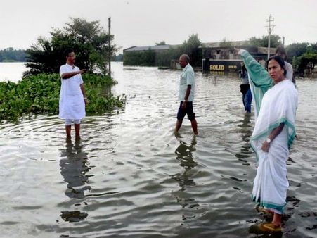 Unlike Modi, Nitish, Mamata gives a skip to aerial survey, wades through floodwaters in WB