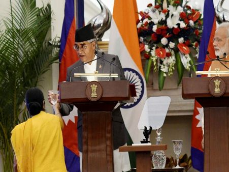 Good host Sushma offers water to a coughing Nepal PM Deuba at presser