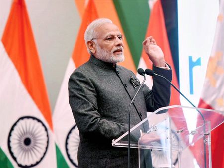 In Manila, Modi questions Congress on governance and scams