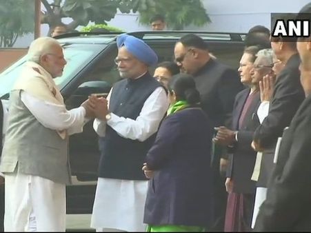 After war of words, PM Modi shakes hands with Manmohan Singh
