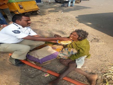 Viral picture of Hyderabad cop feeding homeless woman restores our faith in humanity